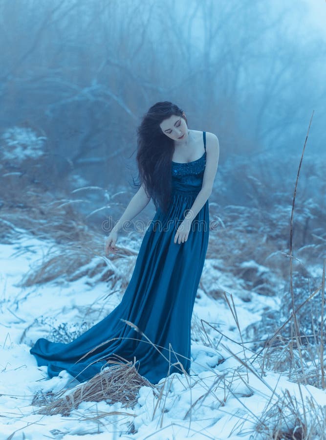 Lady in a luxury lush blue dress, fantastic shot, fairytale princess is walking in the winter forest, fashionable toning, creative computer colors