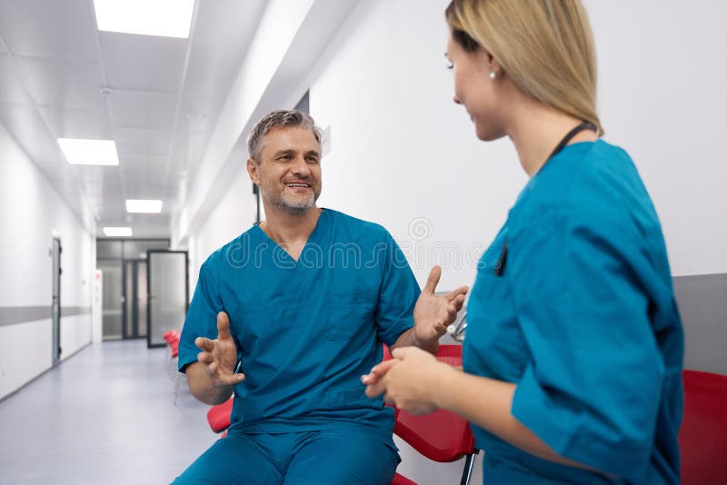 Lady and Men Dressed As Doctors Communicate Stock Image Image of team