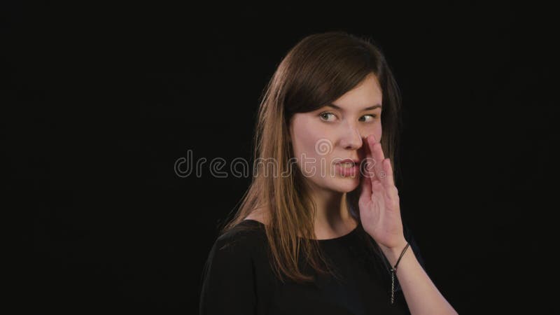 A Lady Mimicing Against a Black Background