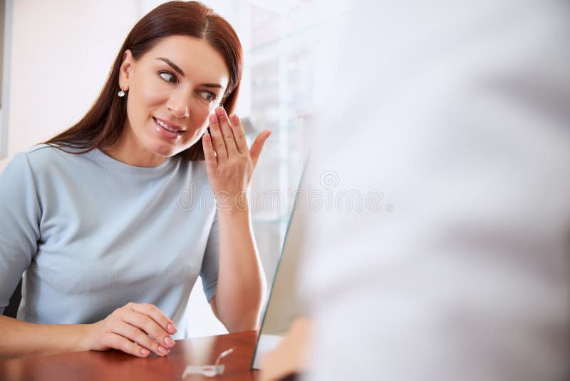 Interested woman trying a lens for the first time