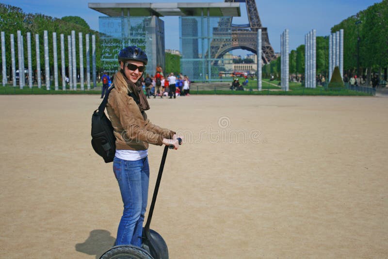 Lady riding a Segway machine in Paris