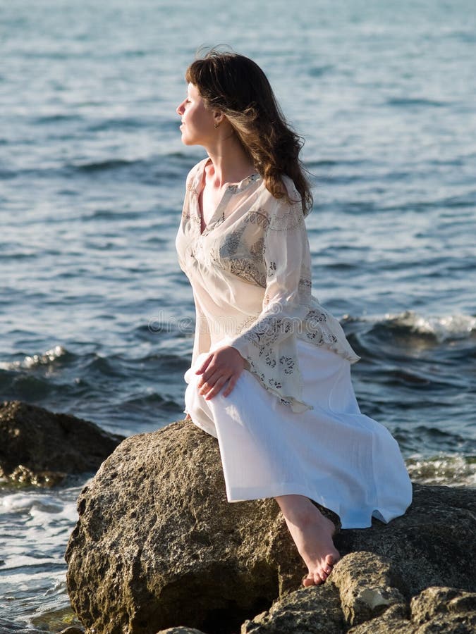 Lady Sitting on Sea Rock