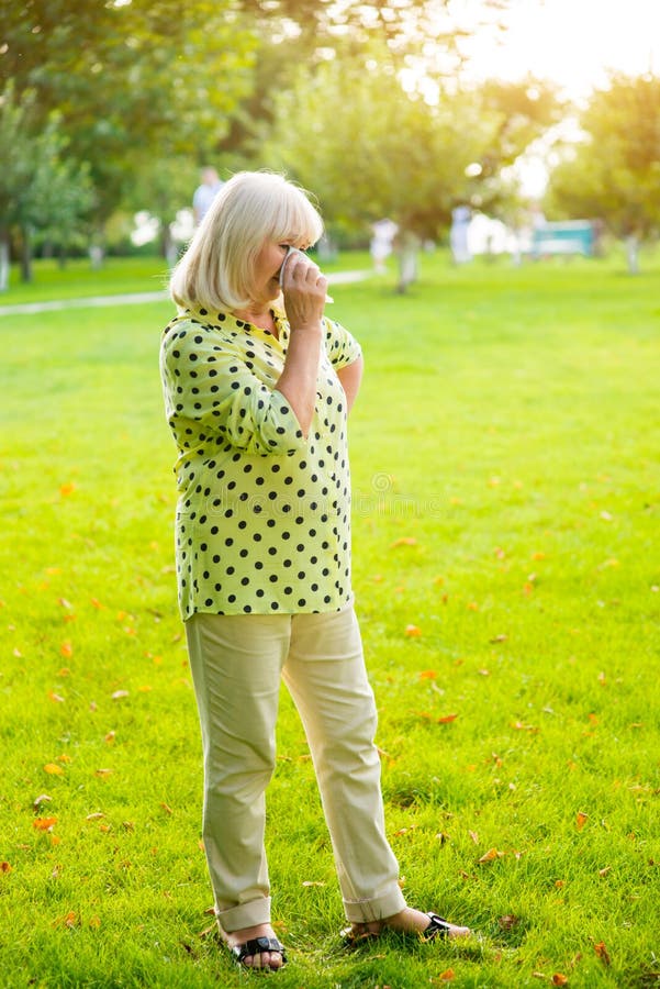 Lady wiping eye with handkerchief. royalty free stock photography Lady wiping eye with handkerchief. royalty free stock photography