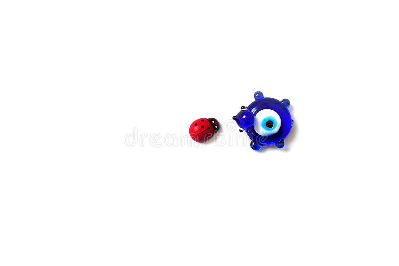 Ladybug and Evil Eye Bead on a White Background, Close Up Ladybug, Evil