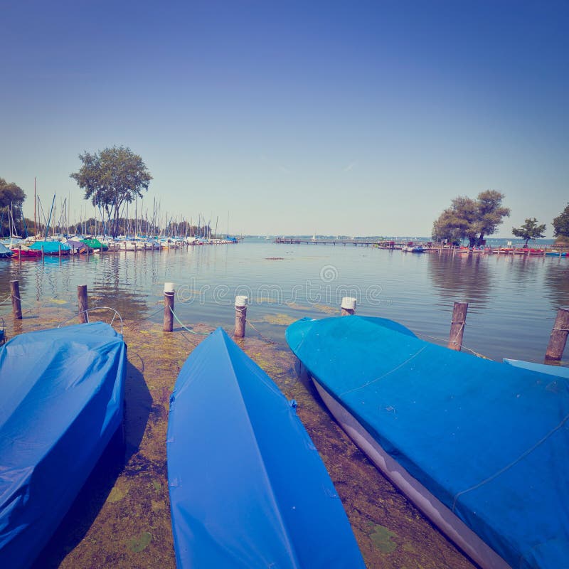 Tarpaulin Covers for Boats, the Lake Chiemsee in Bavaria, Instagram Effect. Tarpaulin Covers for Boats, the Lake Chiemsee in Bavaria, Instagram Effect