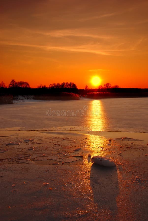 Winter sunset on a frozen lake. Winter sunset on a frozen lake