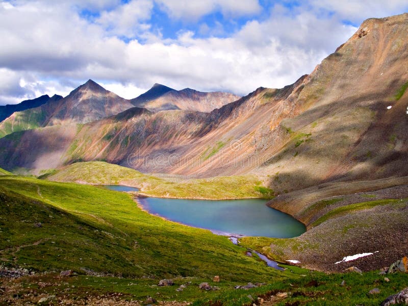 Mountain lake, wild landscape, high mountains, turquoise water, blue sky with clouds, Siberia, Russia, Shumak river. Mountain lake, wild landscape, high mountains, turquoise water, blue sky with clouds, Siberia, Russia, Shumak river