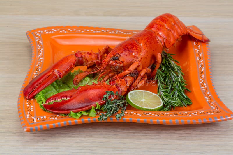 Boiled lobster served with thyme and rosemary. Boiled lobster served with thyme and rosemary