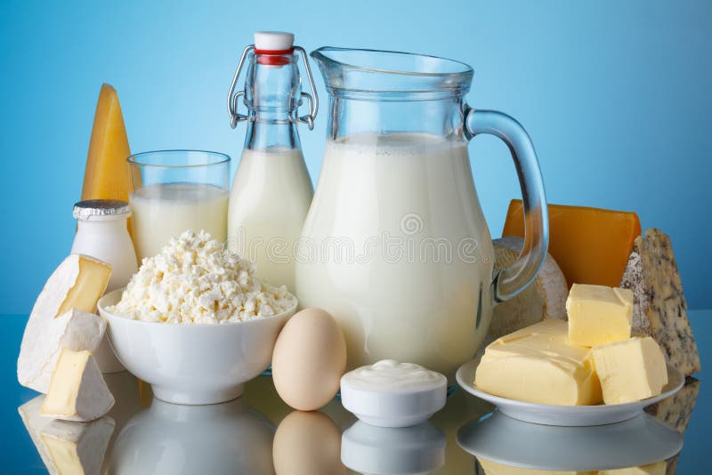 Dairy products, milk, cheese, egg, yogurt, sour cream, cottage cheese and butter on blue background still life. Dairy products, milk, cheese, egg, yogurt, sour cream, cottage cheese and butter on blue background still life