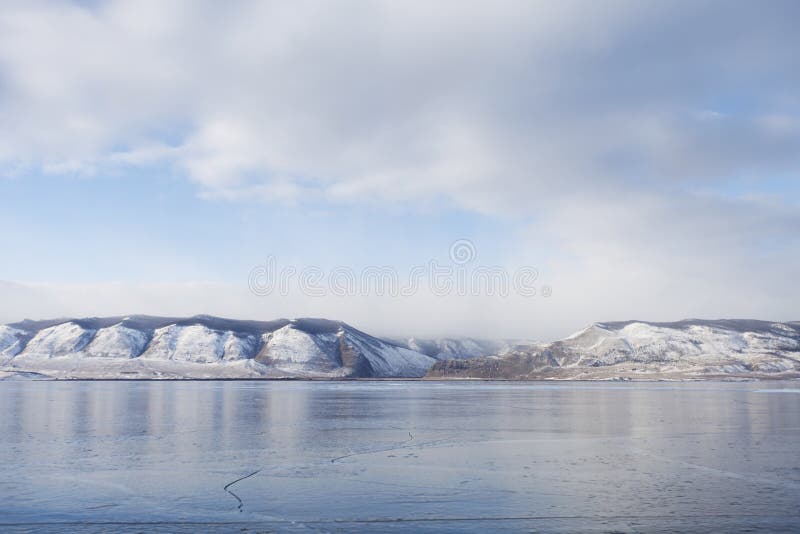 Lake Baikal ice. Mountains. Winter landscape