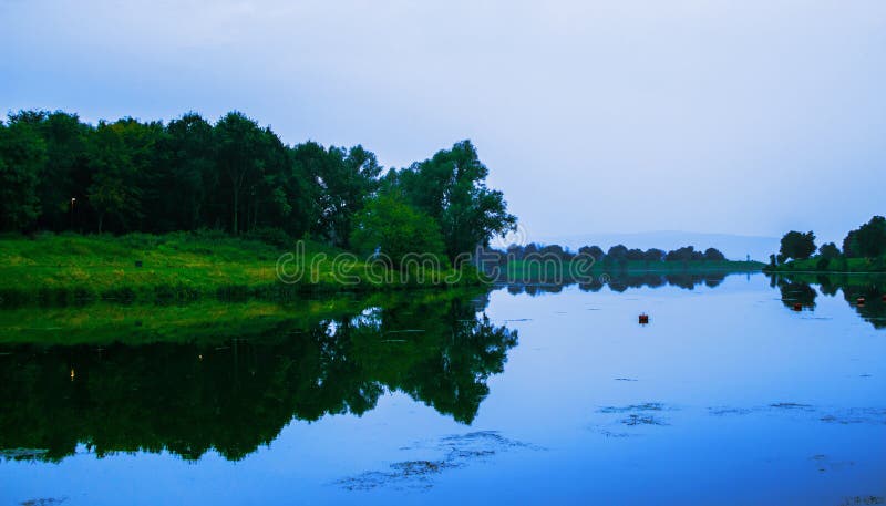 Lake in a beautiful peaceful place. Evening ore royalty free stock photo Lake in a beautiful peaceful place. Evening ore royalty free stock photo