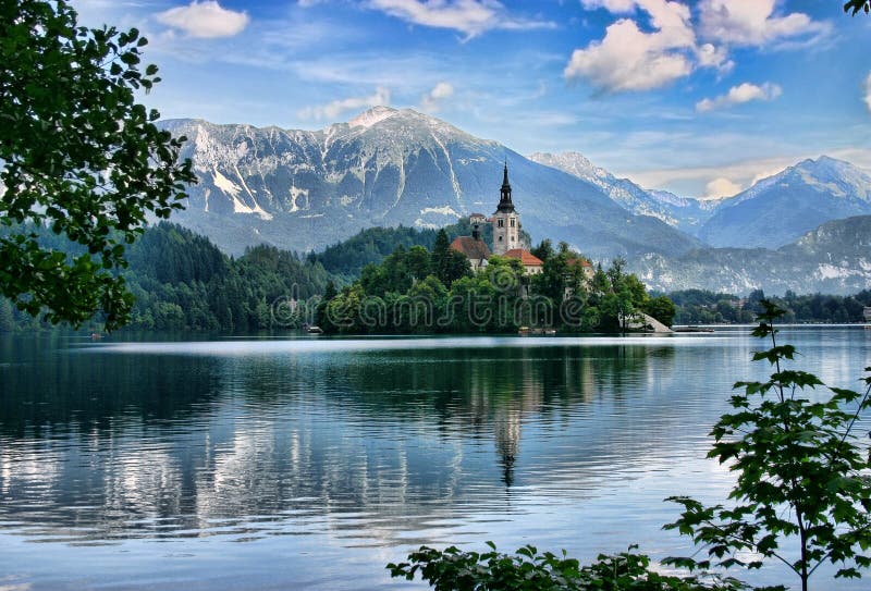 Lake Bled island with a church. Lake Bled, island with a church and the alps in the background, Slovenia royalty free stock image Lake Bled island with a church. Lake Bled, island with a church and the alps in the background, Slovenia royalty free stock image