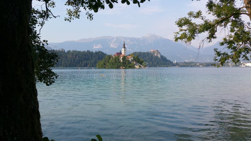 Lake Bled, Slovenia. Lake Bled is in the Julian Alps of the Upper Carniolan region of northwestern Slovenia. The lake is of mixed glacial and tectonic origins stock photos Lake Bled, Slovenia. Lake Bled is in the Julian Alps of the Upper Carniolan region of northwestern Slovenia. The lake is of mixed glacial and tectonic origins stock photos