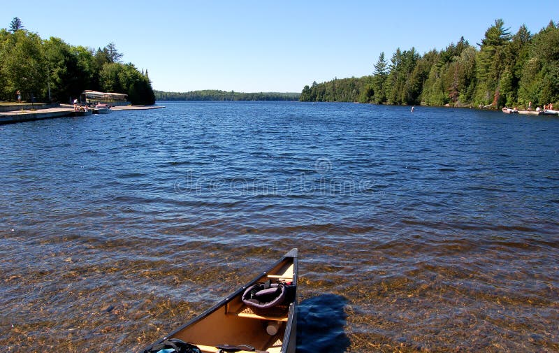 Lake and canoe after portage royalty free stock photography Lake and canoe after portage royalty free stock photography