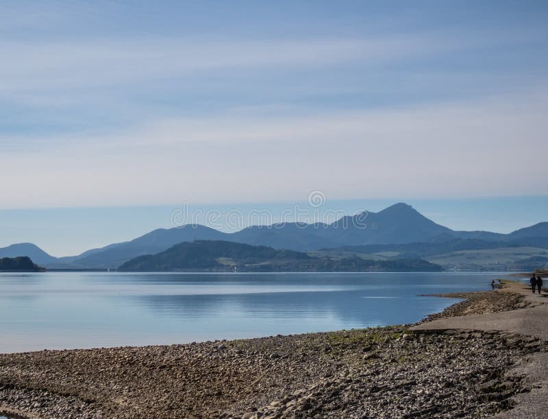 The lake with clear turquoise water is surrounded by mountains. Liptovska Mara Slovakia. The concept of ecological and active tour