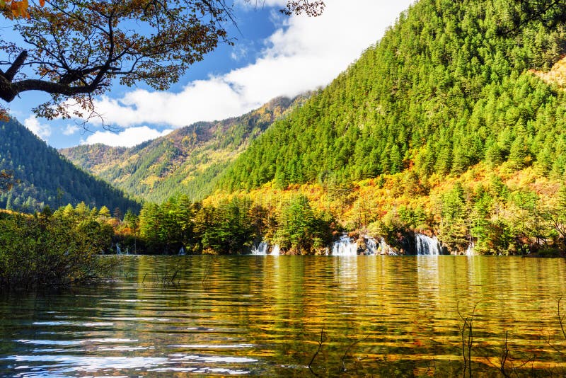 Lake With Crystal Clear Water Among Foliage Of Trees In Autumn Stock