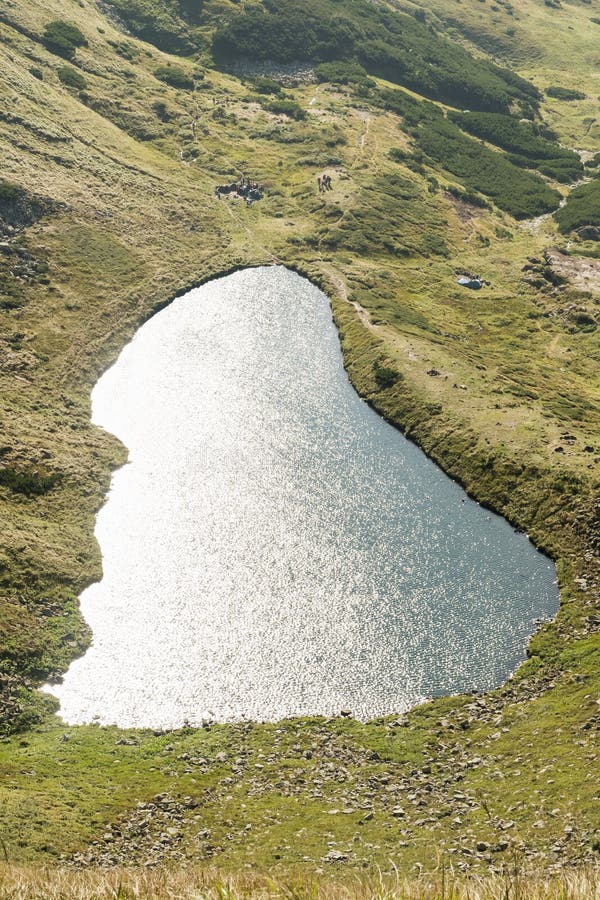 Lake at the foot of mountain stock photo Lake at the foot of mountain stock photo
