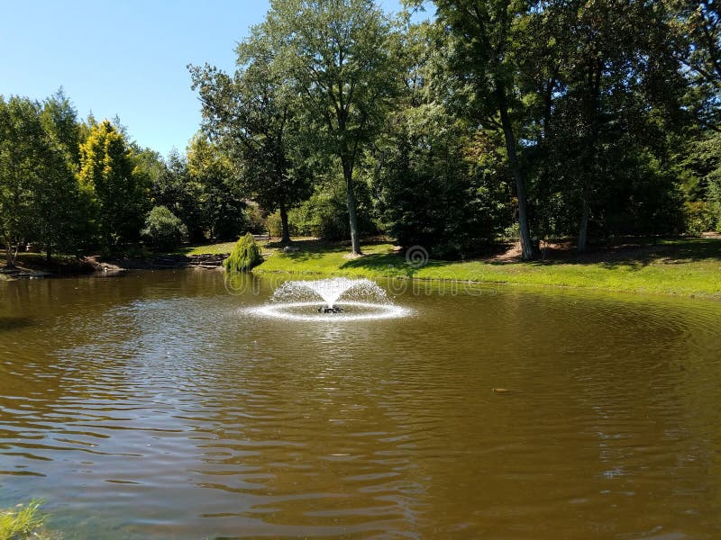 Fountain in the green park stock photo. Image of shape 146534694