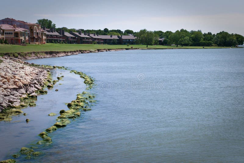 Condos on a lake in Texas stock photo. Image of texas 16247750