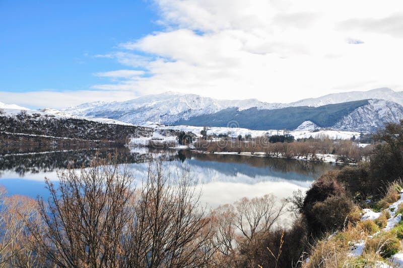 Lake Hayes with Snow Mountain Reflections Stock Image - Image of house ...