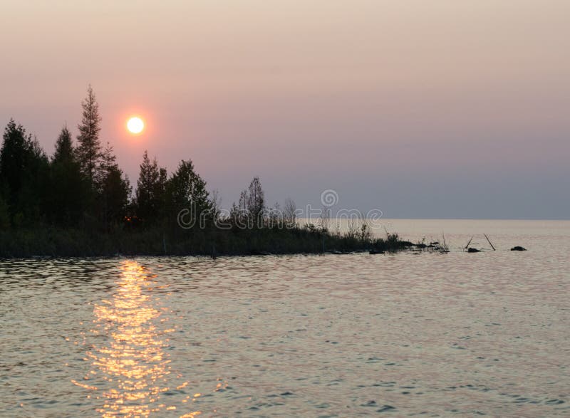 Lake Huron Shoreline Blue Green Water and Limestone Rocks Along Stock