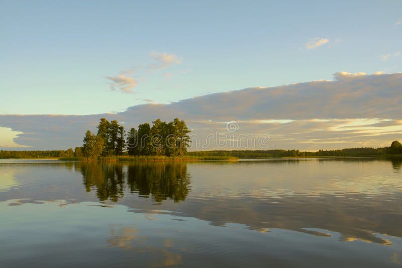 Evening on lake with island. Evening on lake with island