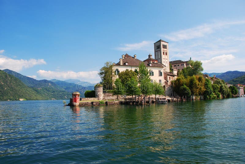 The island of San Giulio by the Italian lake - lago d'Orta, Piemonte, Italy. The island of San Giulio by the Italian lake - lago d'Orta, Piemonte, Italy.