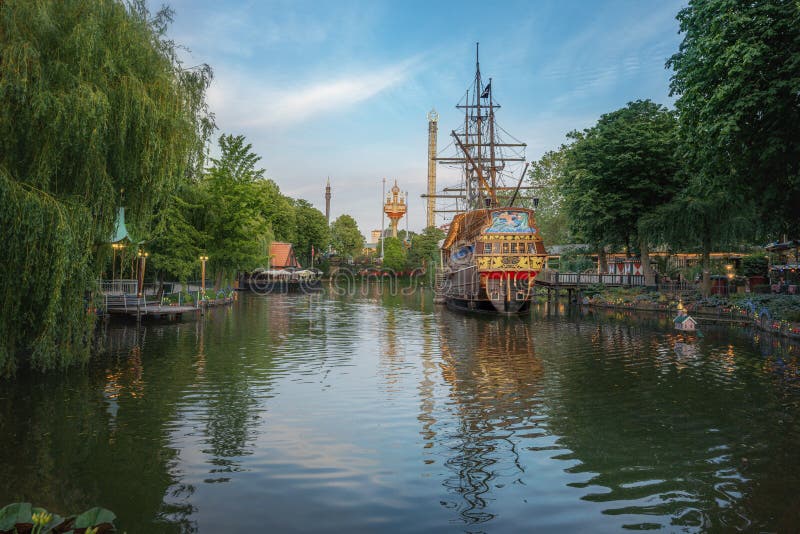 Copenhagen, Denmark - Jun 25, 2019: Lake and Pirate Ship at Tivoli Gardens Amusement Park - Copenhagen, Denmark