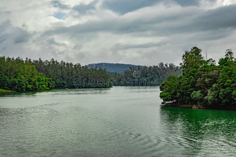 Lake pristine with forest water reflection at morning image is taken at south india. it is showing the beautiful landscape of south india