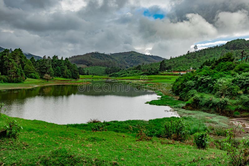 Lake pristine with mountain water reflection at morning image is taken at south india. it is showing the beautiful landscape of south india