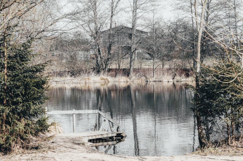 lake. wilderness house on the beach. have toning. almost black and white photo stock photos lake. wilderness house on the beach. have toning. almost black and white photo stock photos