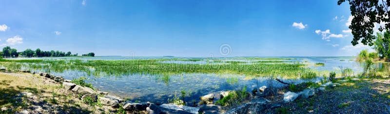 Lakeshore landscape at Saginaw Bay. Lakeshore landscape in summer, at Saginaw Bay, near Bay City, Michigan. Natural beauty. Panoramic view