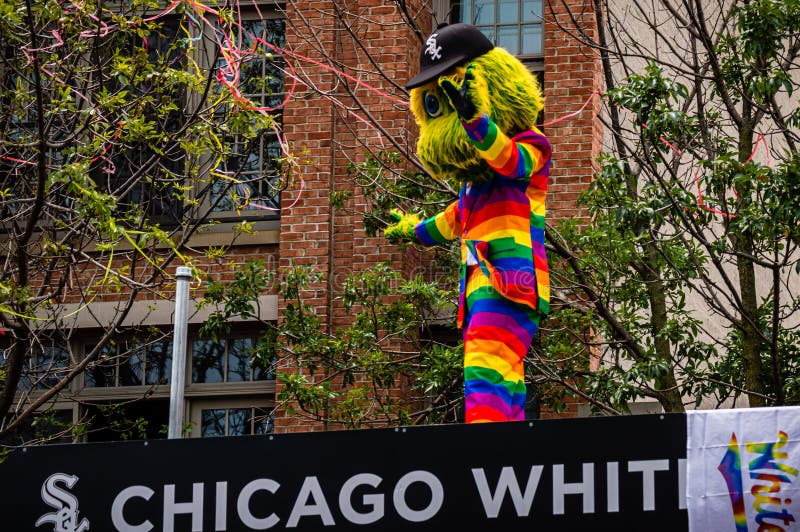 Chicago White Sox mascot Southpaw wearing a rainbow suit and waving to the crowd at Gay Pride