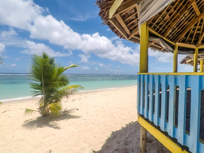 Lalomanu Beach, Upolu Island, Samoa - October 27, 2017: Traditional Samoan waterfront beach fale huts provide budget accommodation but with a fantastic view. Lalomanu Beach, Upolu Island, Samoa - October 27, 2017: Traditional Samoan waterfront beach fale huts provide budget accommodation but with a fantastic view