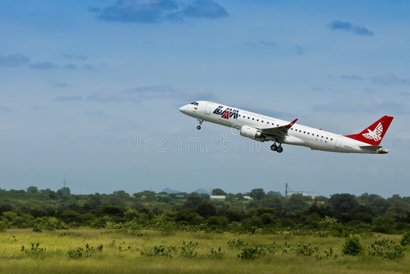 LAM Airlines, Embraer 190 Jet Editorial Photo Image of tail, plane