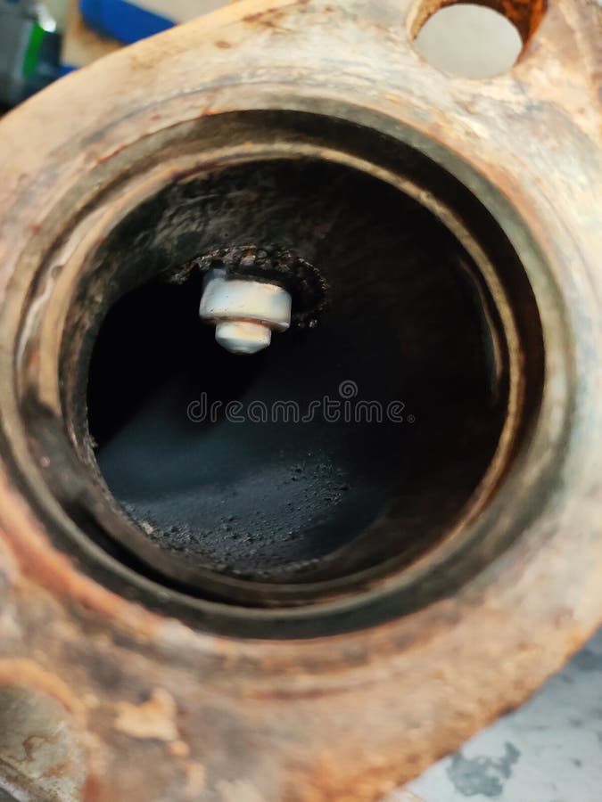 Lambda probe, exhaust gas oxygen sensor, inside the pipe. Internal combustion engine vehicle, repair and service concept. Close-up stock image