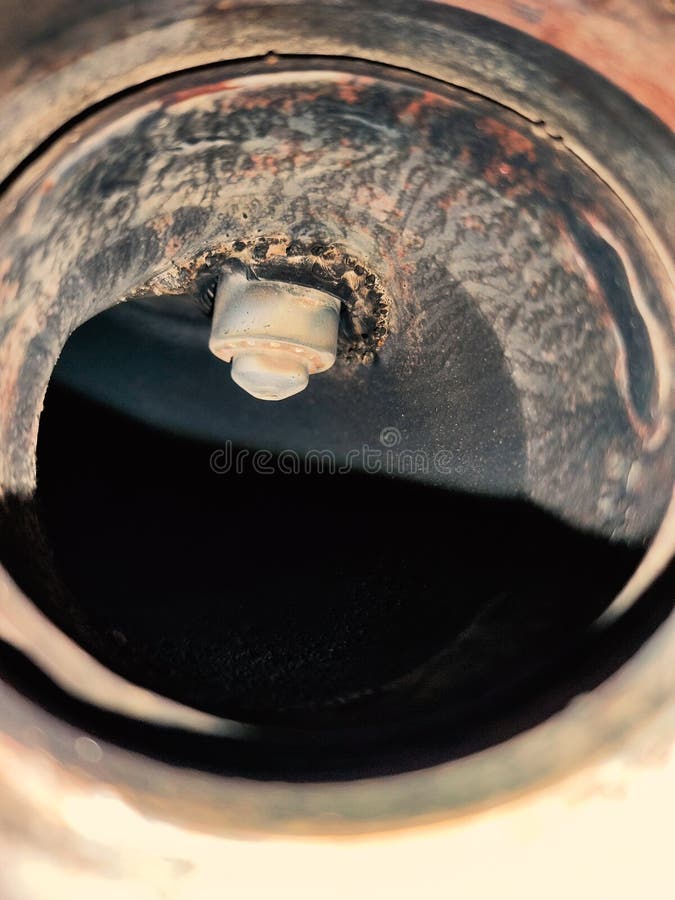 Lambda probe, exhaust gas oxygen sensor, inside the pipe. Internal combustion engine vehicle, repair and service concept. Close-up royalty free stock photography