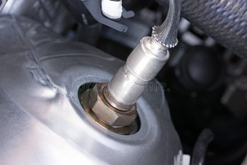 Lambda probe on a modern internal combustion engine royalty free stock photography