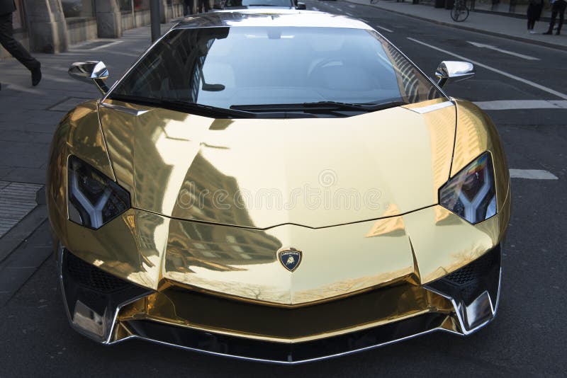 Golden Lamborghini sport car in the street