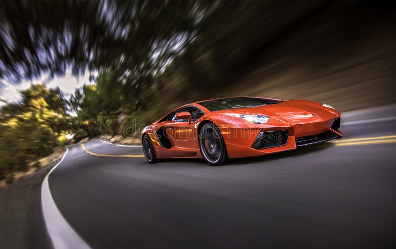 A Lamborghini Aventador supercar out for a morning cruise at speed in Live Oak Canyon. A Lamborghini Aventador supercar out for a morning cruise at speed in Live Oak Canyon.