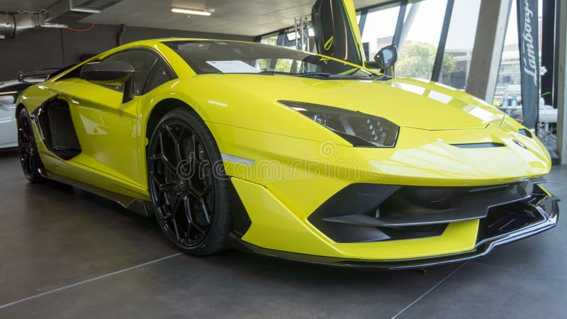 A view of the 2021 Lamborghini Aventdor SVJ coupe sports car on display in a showroom. The 2021 Aventador SVJ is one of the last standing sportscars with a Naturally Aspirated V12 from Sant Agata. This hardcore track-focused Lambo comes with 770 hp that screams all the way to 8,500 RPM. Minute updates such as a carbon-fiber badge and a glovebox now make their way into the 2021 Aventador SVJ Coupe. A view of the 2021 Lamborghini Aventdor SVJ coupe sports car on display in a showroom. The 2021 Aventador SVJ is one of the last standing sportscars with a Naturally Aspirated V12 from Sant Agata. This hardcore track-focused Lambo comes with 770 hp that screams all the way to 8,500 RPM. Minute updates such as a carbon-fiber badge and a glovebox now make their way into the 2021 Aventador SVJ Coupe.