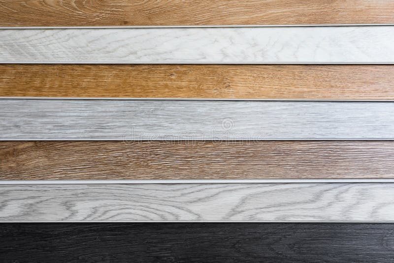 Laminate Flooring Planks Variations on Concrete Floor Stock Photo