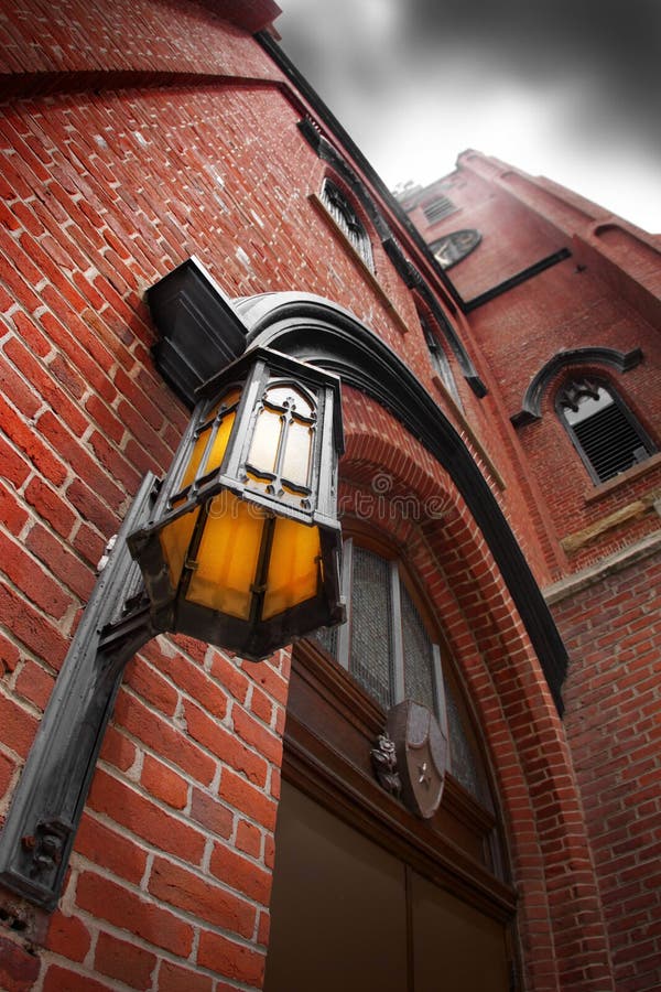 Lamp on red Brick Wall