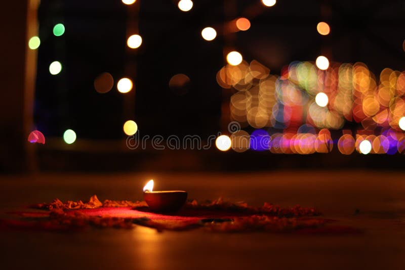 A Lamp Burning on Rangoli and Blurred Background Light on Day of Diwali  Stock Photo - Image of view, rangoli: 131643270