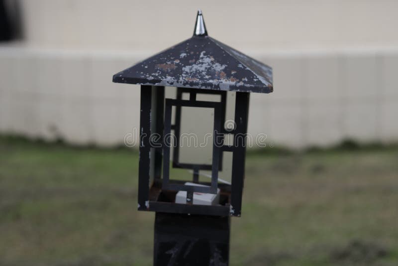 Lamp holder in the garden stock image. Image of green 228990973