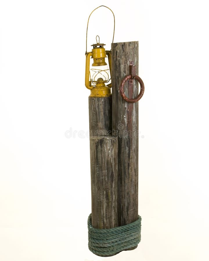Oil lamp on wooden post stock photo. Image of metal, petrol 20996210