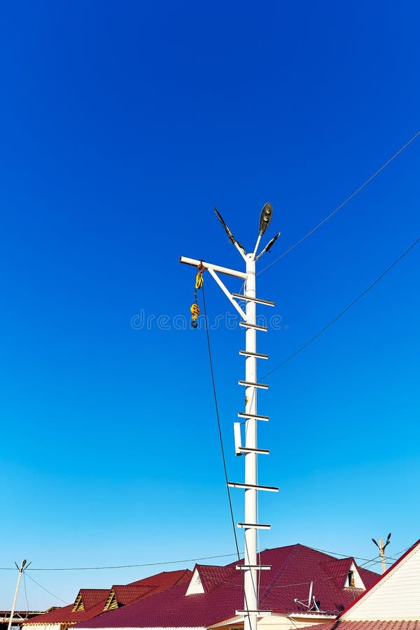 Lamppost with a Hook Attached To it for Lifting Cargo Stock Image