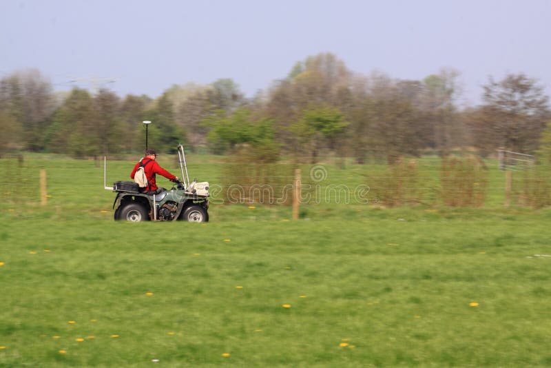 Land surveyor with quad stock image. Image of drive, driver 19288765