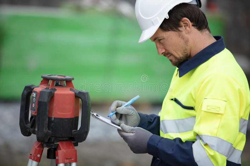 Land Surveyor at Work on Construction Site Stock Image Image of