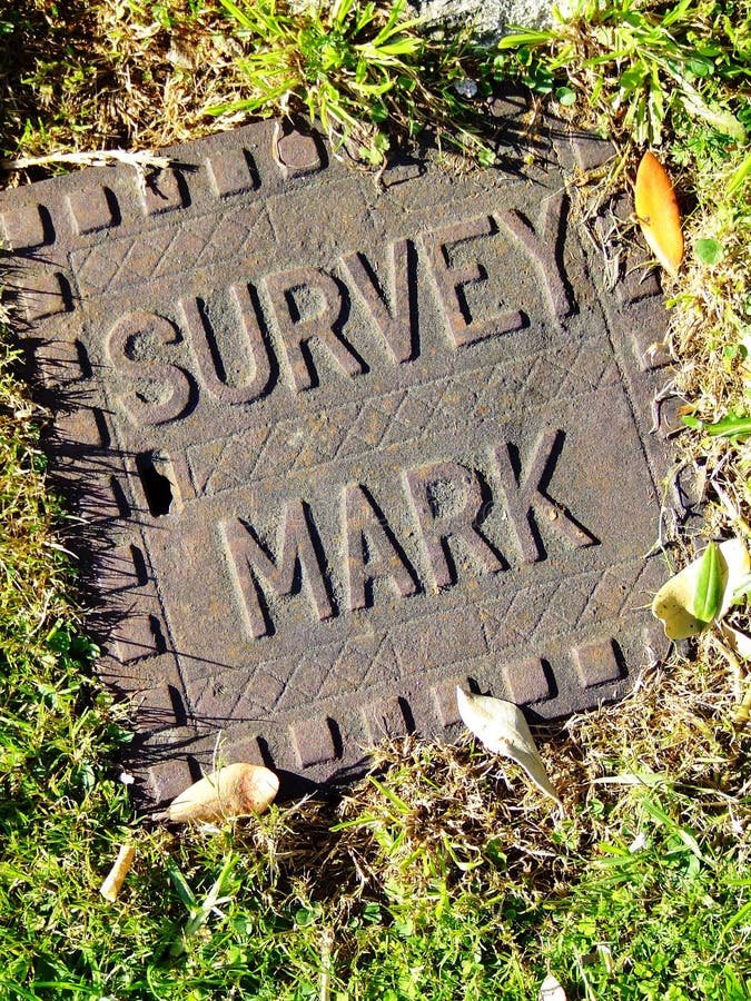 Close-up of a covered survey mark used by land surveyors. Close-up of a covered survey mark used by land surveyors.